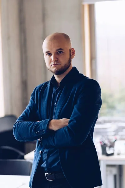 Man office worker standing in office.