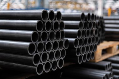 Black steel pipes on the stack clipart