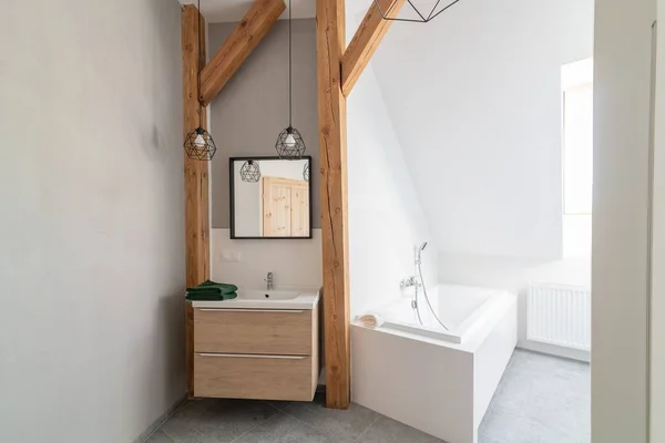 Modern loft bathroom with mirror in the loft apartment