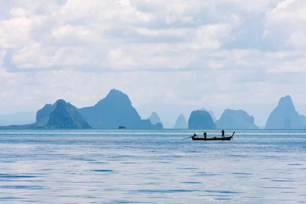 Two men in a boat fishing