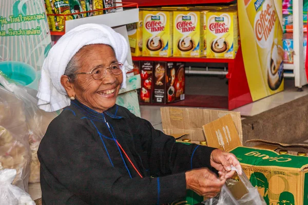 Portrait old woman serving — Stock Photo, Image