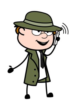 Çizgi film casusu cep telefonundan konuşuyor.