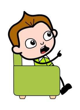 Çizgi roman öğrencisi kanepede oturuyor.