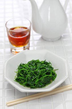 chinese white wine stir fried with toothed bur clover, shanghai cuisine clipart