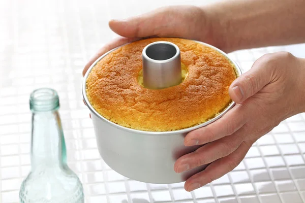 homemade orange chiffon cake cooking, cooling process
