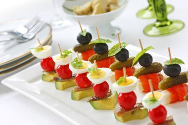 canapes on toothpicks , appetizer, pinchos , spanish food