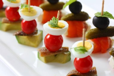 canapes on toothpicks , appetizer, pinchos , spanish food