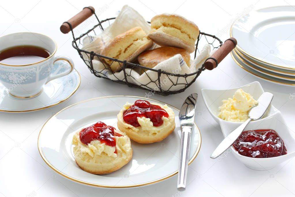 scone with strawberry jam and clotted cream , tea party , afternoon tea , buttermilk biscuits