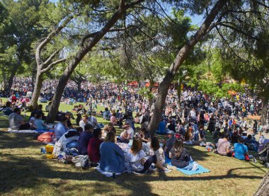 Madrid, Spain - May 15, 2018. Citizens honoring its patron, Saint  Isidro Labrador, at San Isidro festivity fair, in Pradera de San Isidro park of Madrid. clipart