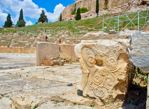 Remains of carved pedestal stone of the Theatre of Dionysus Eleuthereus. Acropolis of Athens. Attica region, Greece.