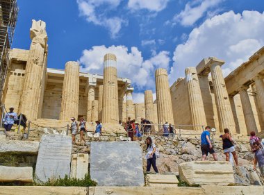 Athens, Greece - July 1, 2018. Tourists crossing the western side of Propylaea, the ancient gateway to the Athenian Acropolis. Athens. Attica, Greece. clipart