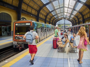 Athens, Greece - July 1, 2018. Citizens and tourists waiting for a train in Piraeus Metro station. Athens. Attica, Greece. clipart