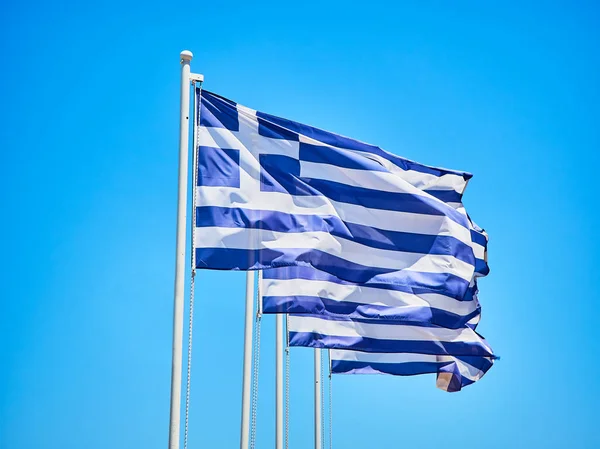 Four Official Flags Greece Waving Blue Sky — Stock Photo, Image