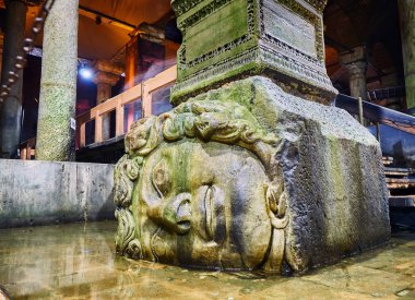 Sideways head of Medusa located at the northwest edge of the subterranean Basilica Cistern, also known as Yerebatan Sarnici. Istanbul, Turkey. clipart