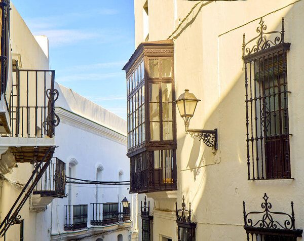 A typical street with whitewashed walls of Vejer de la Frontera downtown. Jose Castrillon street. Cadiz province, Andalusia, Spain.