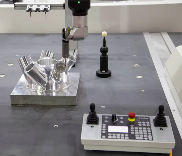 CNC Coordinate Measuring Robotic Machine measuring on workpiece