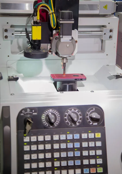 Mobile phone case engraving in CNC laser machine