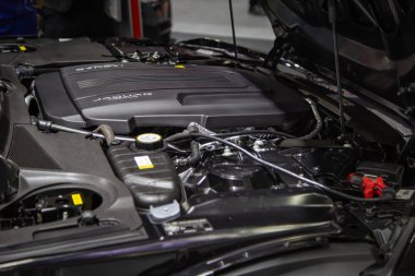 Nonthaburi, Thailand - December 4, 2018: Jaguar F-Type engine room open for maintenance clipart