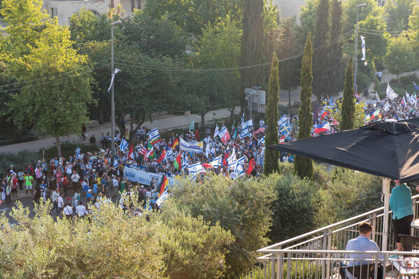 JERUSALEM, ISRAEL - MAY 15, 2018: Crowd of Christian people marching on the streets of Jerusalem during the March of the Nations, one day after US opens its embassy in Jerusalem