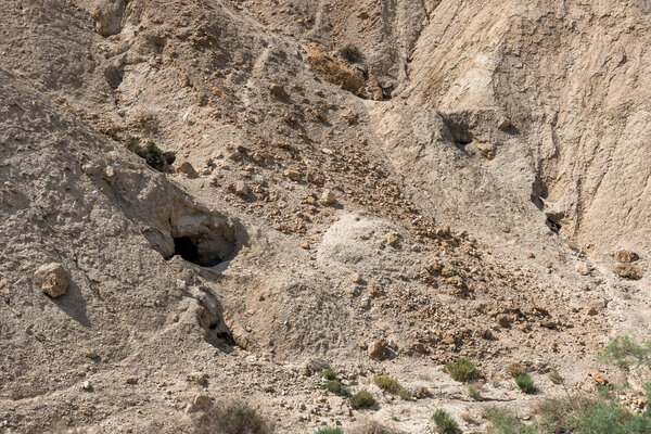 The Qumran caves, West bank, Israel is the place in the Holy Land, where the Dead Sea Scrolls were discovered