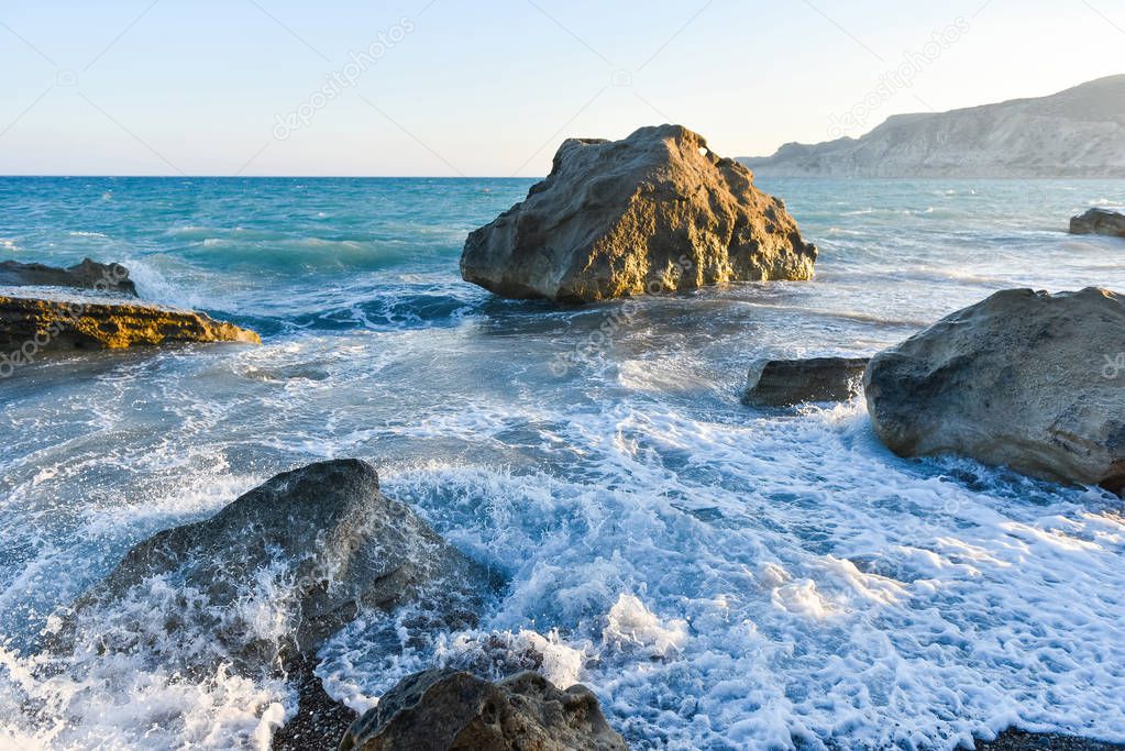 White waves crashing against a rocky beach