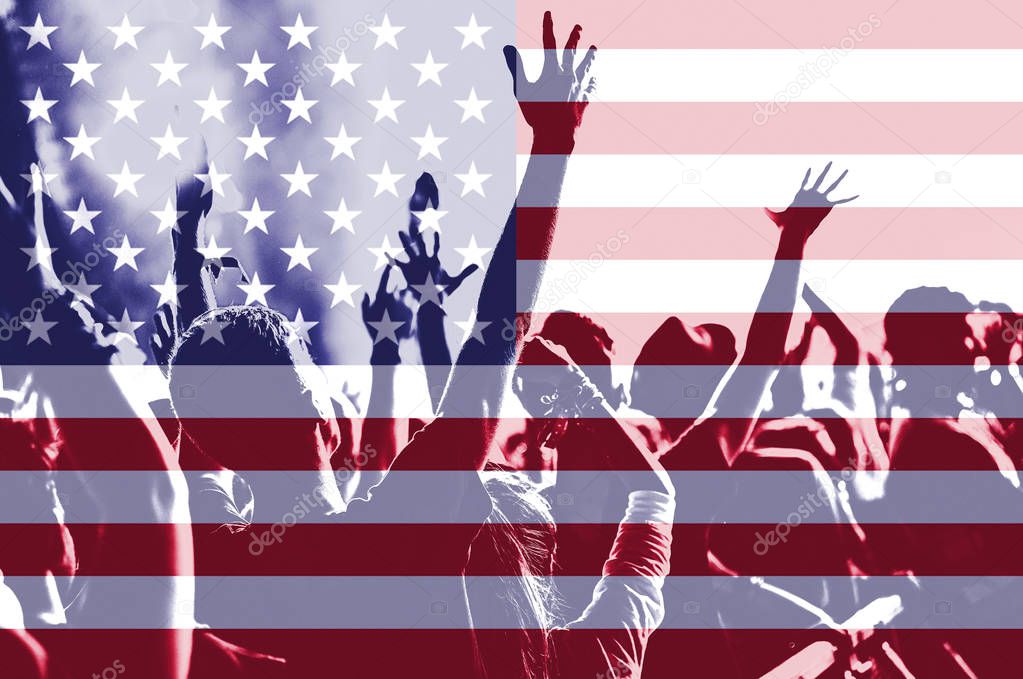 People celebrating Independece day in the United States of America. Patriotic concept. Background of USA flag blending and silhouette of cheering crowd with raised arms