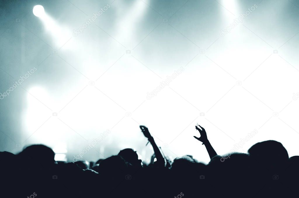 Crowd of people at music concert. Bright stage lights, space for text