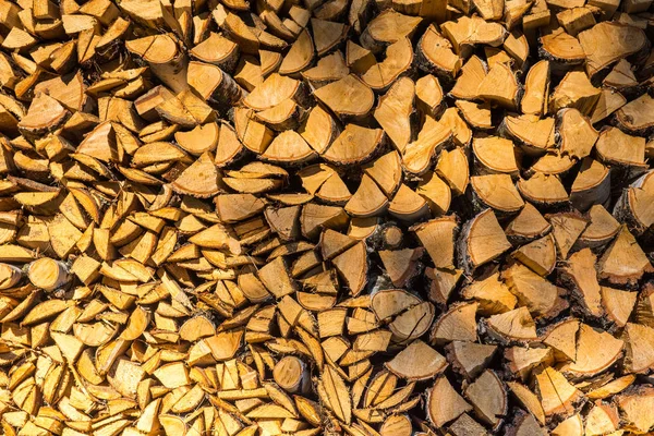 Background of stack of firewood, logs in a pile