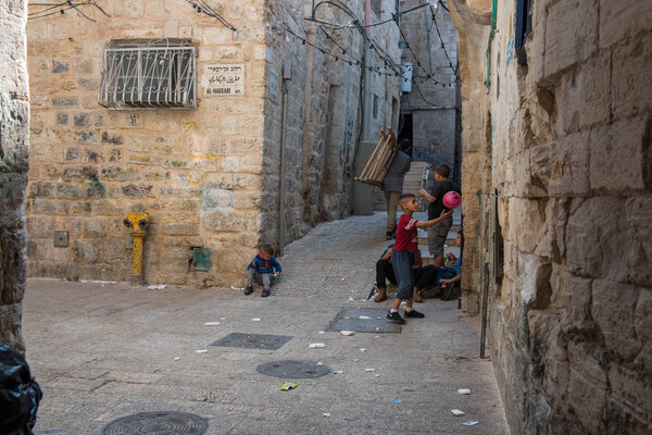 JERUSALEM, ISRAEL - MAY 15, 2018: Local Palestinian children playing in the Muslim Quarter of the city