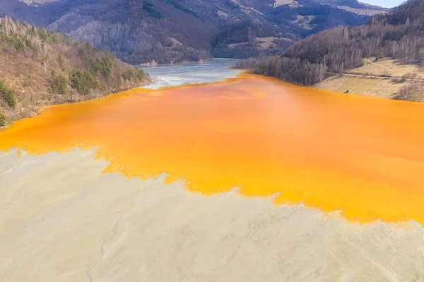 Aerial view of a mining decanting pond with toxic red residuals — Stock Photo, Image