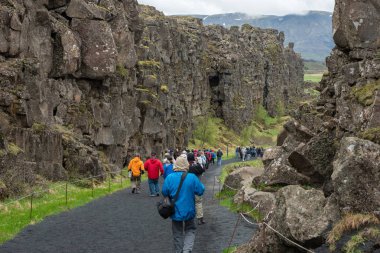 Crowd of tourists visiting Thingvellir, Iceland clipart