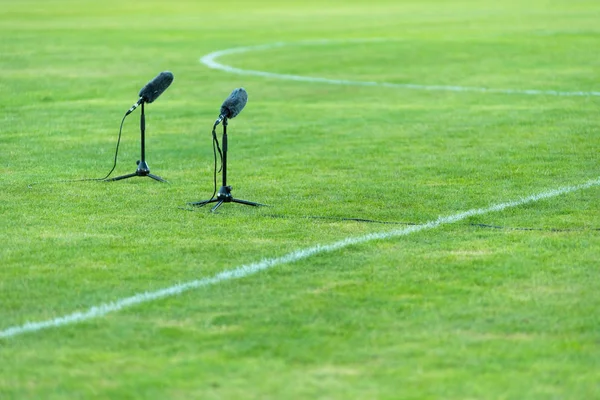 Professional furry microphone on soccer field — Stock Photo, Image