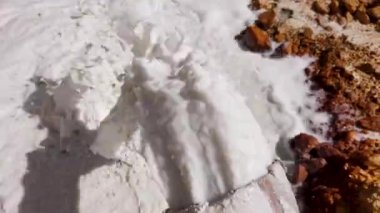 Acidic mine residual water drainage, flowing into decanting pond. Rosia Montana, Romania