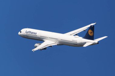 Barcelona, Spain - August 20, 2018: Lufthansa Airbus A321-100 banking left after taking off from El Prat Airport in Barcelona, Spain clipart