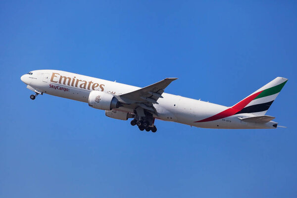 Barcelona, Spain - September 16, 2018: Emirates SkyCargo Boeing 777 Freighter taking off from El Prat Airport in Barcelona, Spain.