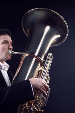 Tuba player brass instrument. Classical musician playing orchestra bass euphonium horn clipart
