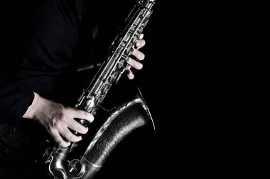 Saxophone Player. Saxophonist playing jazz music. Sax player hands with music instrument closeup clipart