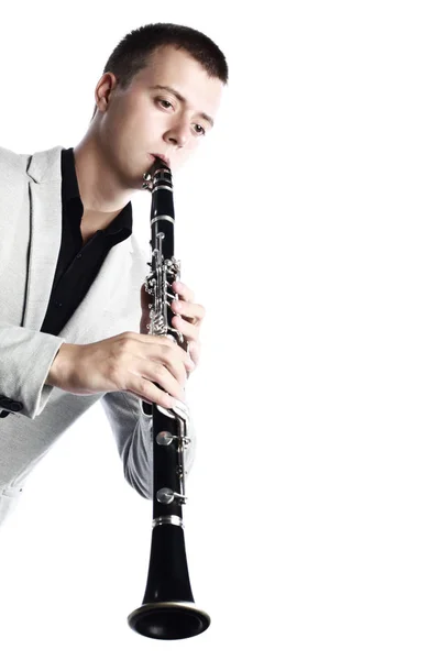 Clarinet player classical musician isolated. Man playing music woodwind instrument