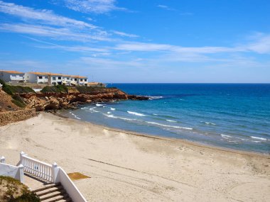 Popular great summer vacation travel destination Cala Cerrada Playa Beach Orihuela Costa South Spain clipart