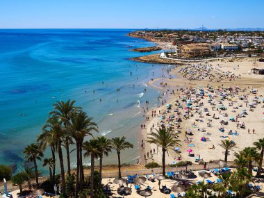 Popular great summer vacation travel destination La Zenia Beach Orihuela Costa South Spain clipart