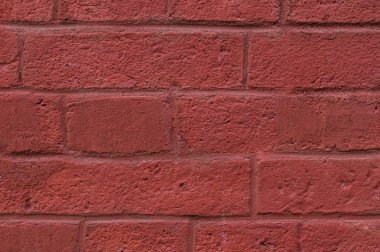 tuğla duvarına kırmızı arka plan boyalı. doku.