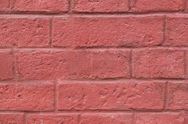 tuğla duvarına kırmızı arka plan boyalı. doku.