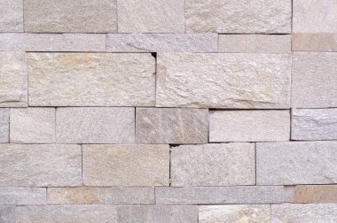 bej taş döşenmiş duvar arka plan yıpranmış. doku.