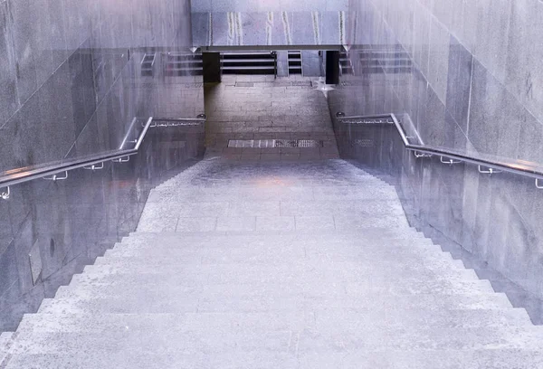 underground crossing staircase at rainy day. urban, weather.