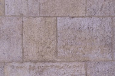 bej yıpranmış granit taş karo duvar arka plan. Doku.