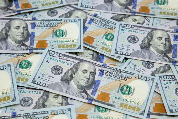 Background of dollar bills. American Dollars Cash Money. One Hundred Dollar Banknotes. Hundred Bucks.