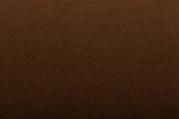 Texture of dark paper. Background for images. copyspace. space for text. sheet of gray craft paper as background. brown paper