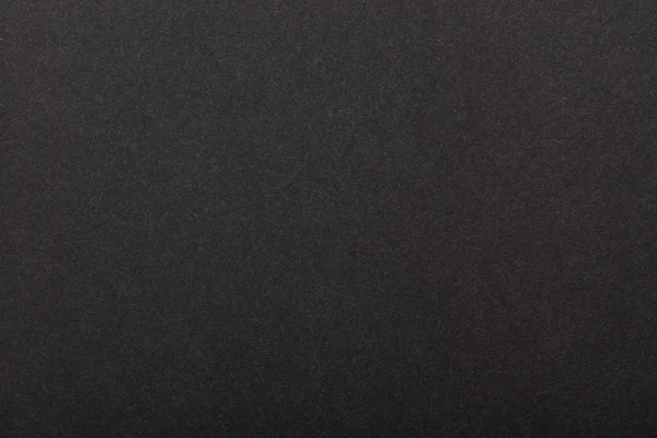 ダークペーパーのテクスチャ。画像の背景。コピースペース。テキスト用のスペース。背景として灰色のクラフトペーパーのシート。黒い紙 — ストック写真