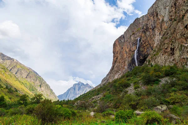 Mountain landscape with a river and a waterfall. Belogorka gorge, Kyrgyzstan