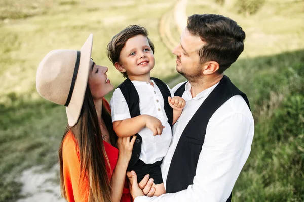 Cheerful family shot on a field